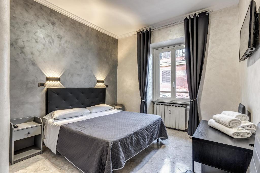 a bedroom with a large bed and a window at Hotel Planet in Rome