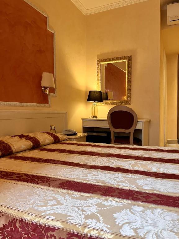Postel nebo postele na pokoji v ubytování Hotel Erdarelli