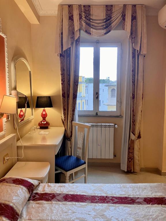 Postel nebo postele na pokoji v ubytování Hotel Erdarelli