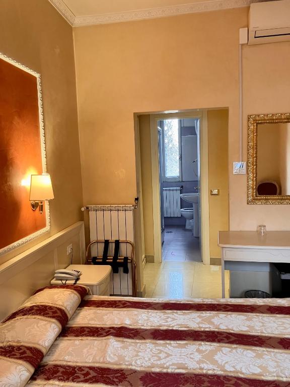 Postel nebo postele na pokoji v ubytování Hotel Erdarelli