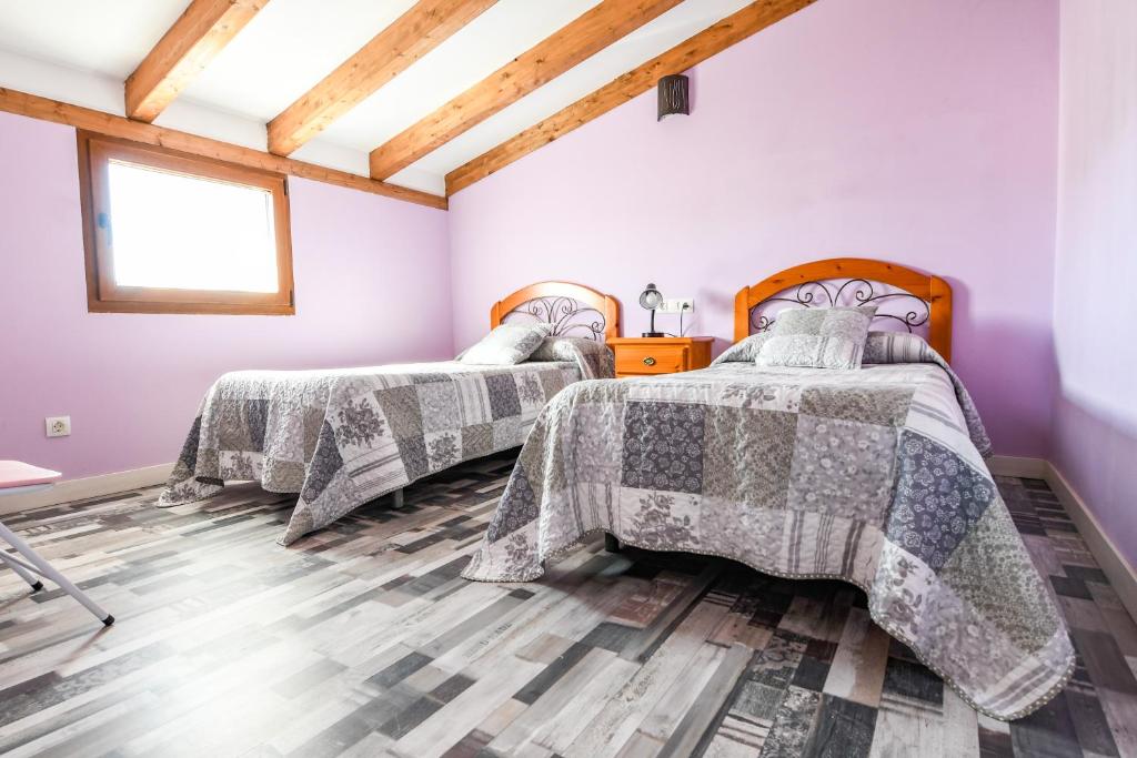 Postel nebo postele na pokoji v ubytování aCienLeguas
