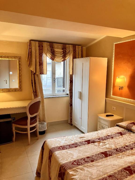 Postel nebo postele na pokoji v ubytování Hotel Erdarelli