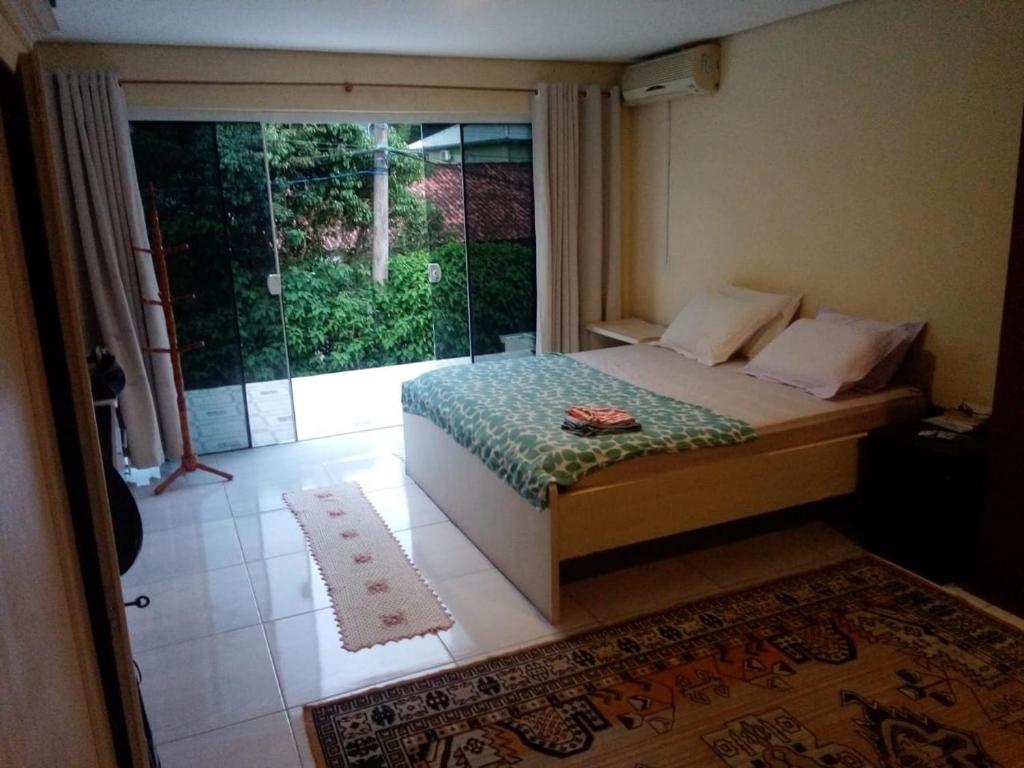 Ένα ή περισσότερα κρεβάτια σε δωμάτιο στο Encantadora Casa Campeche