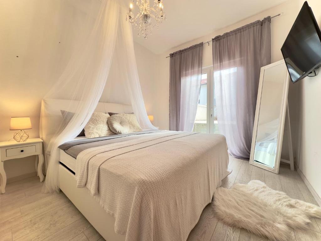 Posteľ alebo postele v izbe v ubytovaní Elite Residence Flos