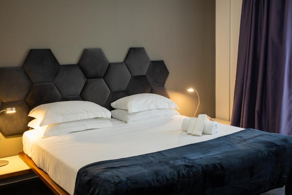 Postel nebo postele na pokoji v ubytování Black Hotel