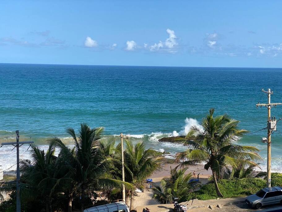 a view of a beach with palm trees and the ocean at Vista incrível para o mar / Beautiful ocean view in Salvador