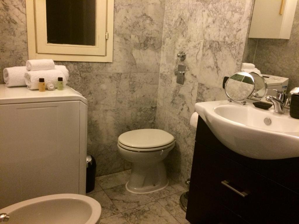 a bathroom with a toilet and a sink at ITD unione in Milan