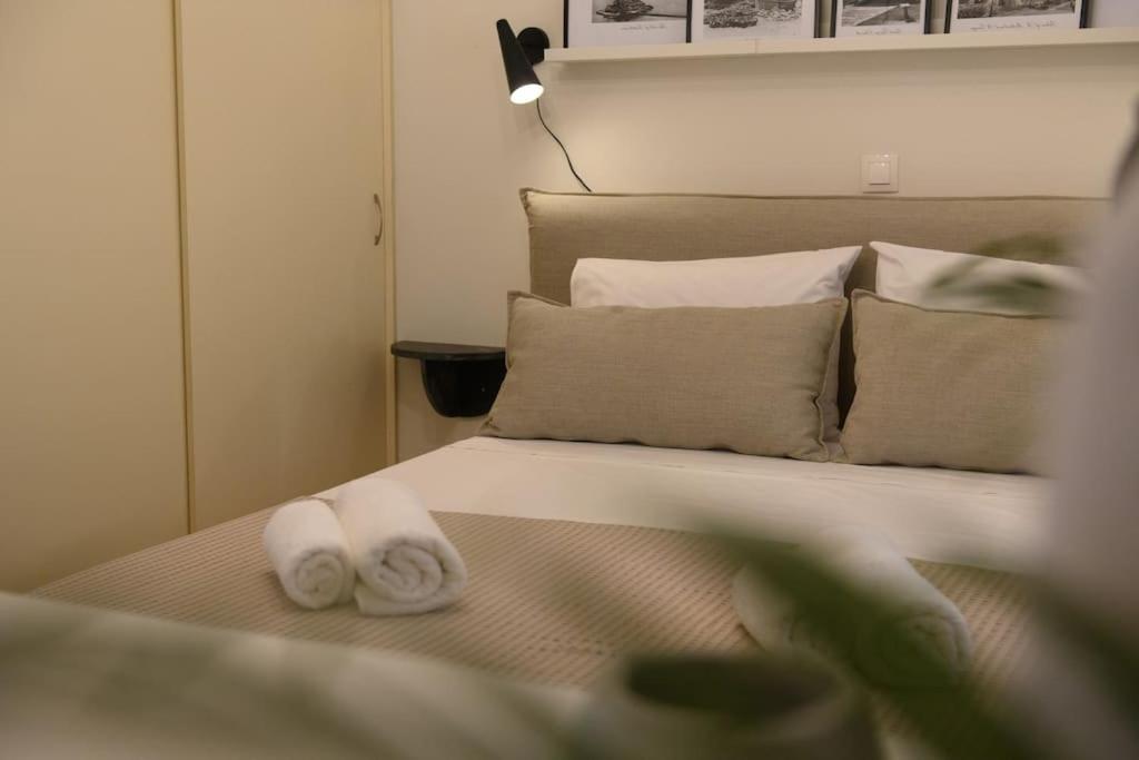 Postel nebo postele na pokoji v ubytování San Rocco Suite
