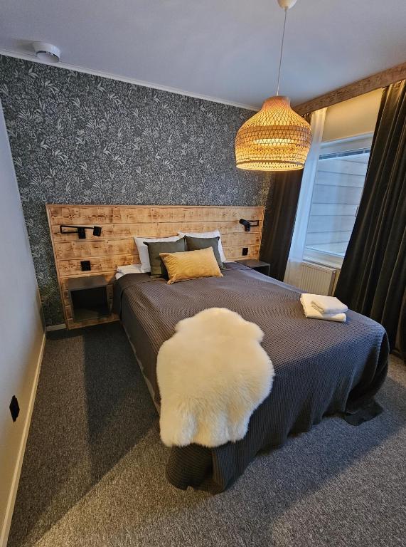 Postel nebo postele na pokoji v ubytování Hotellet i Jörn AB