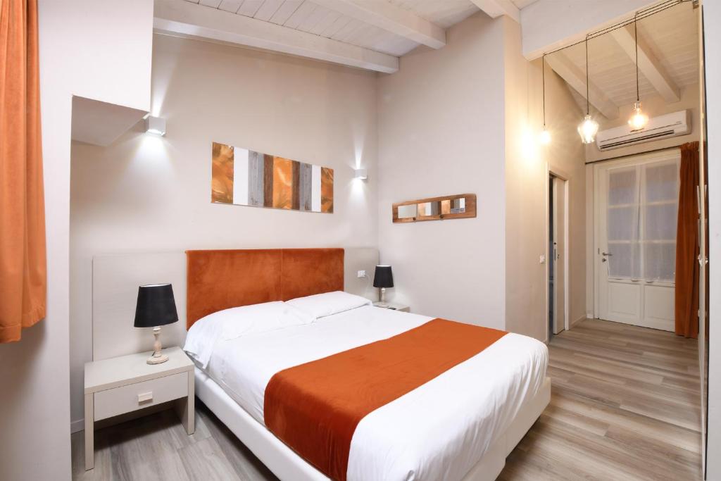 Postel nebo postele na pokoji v ubytování HILL COLLE - camere & bistrot