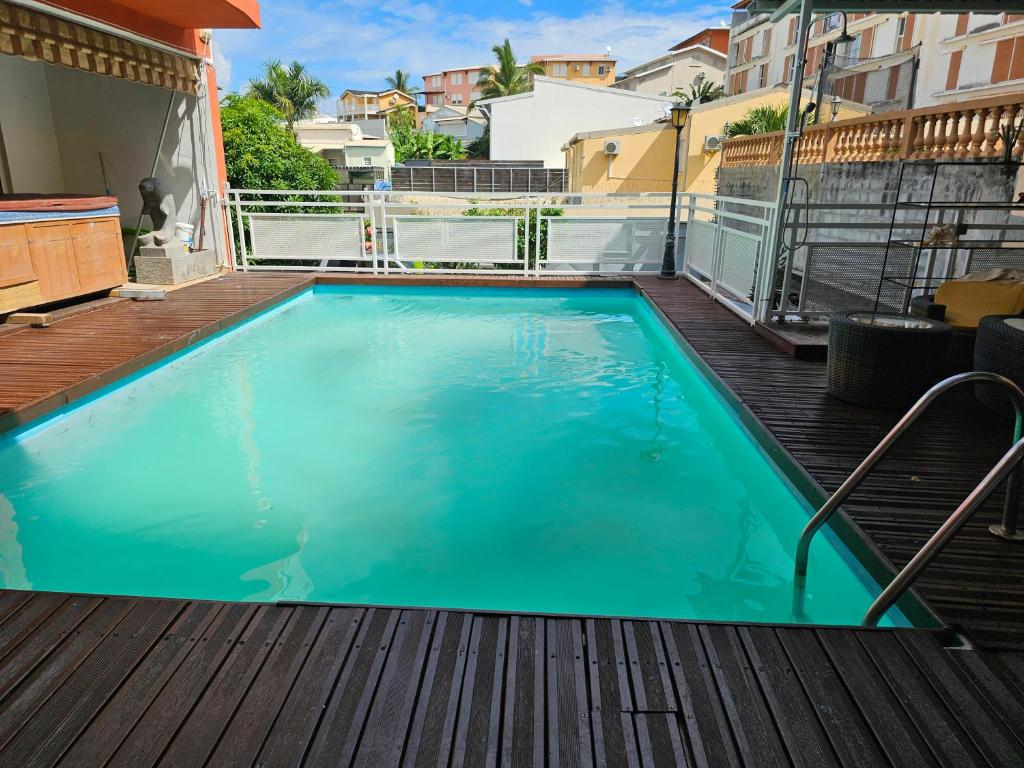 a swimming pool on the deck of a house at VILLA VALIHA in Koungou