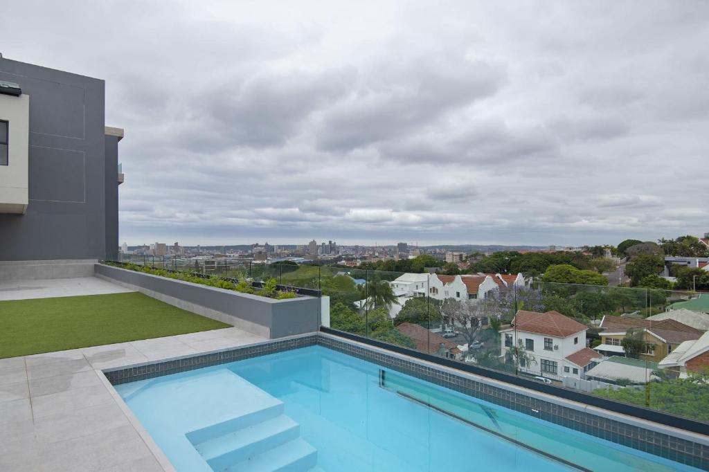 a swimming pool on the roof of a house at 707 at 2SIX2 Florida Road by HostAgents in Durban
