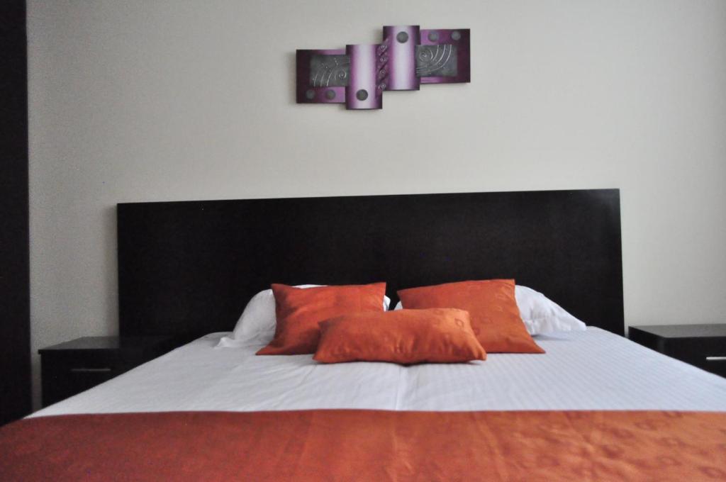 Postel nebo postele na pokoji v ubytování Valdivia Suites