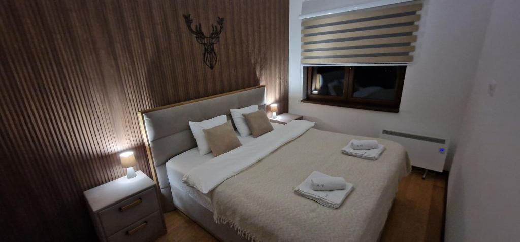 Postel nebo postele na pokoji v ubytování Glečer Kop A11 FREE Parking Garage