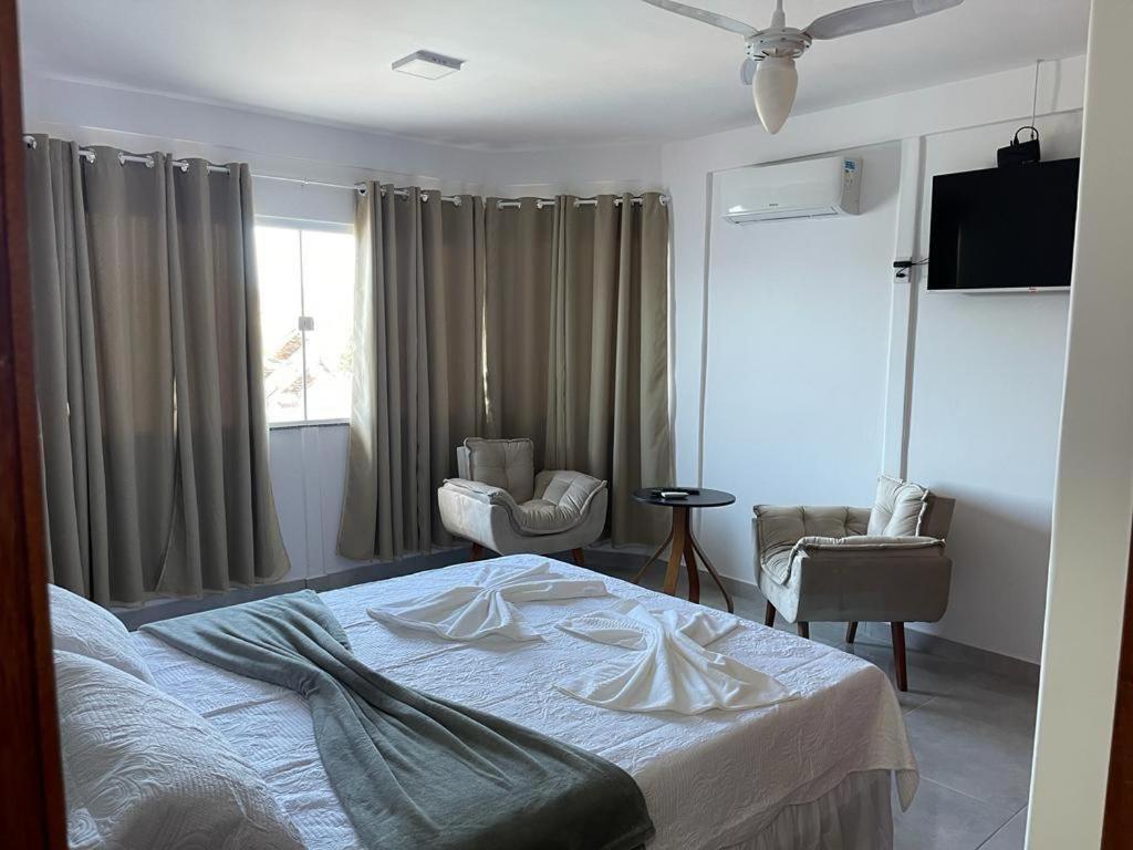 Ένα ή περισσότερα κρεβάτια σε δωμάτιο στο Pousada Casa Serra Alves ll