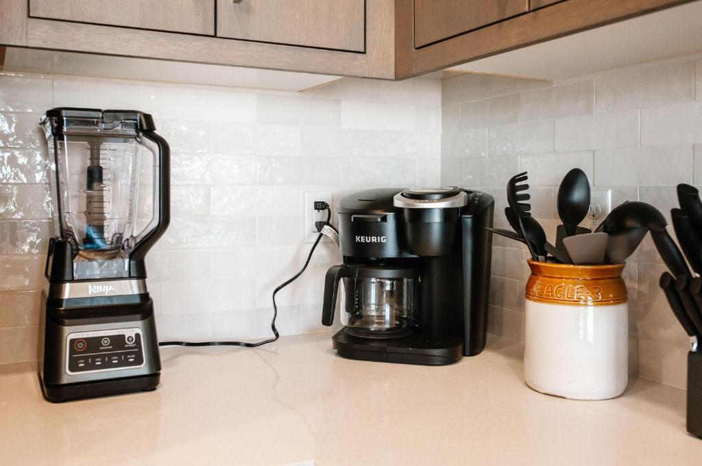 a kitchen counter with a coffee maker and a blender at 20| Vue at Green Valley with Community Pool in St. George