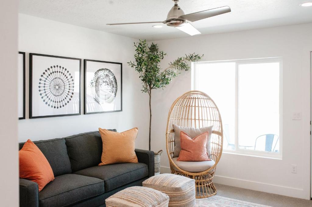 a living room with a couch and a chair at 20| Vue at Green Valley with Community Pool in St. George