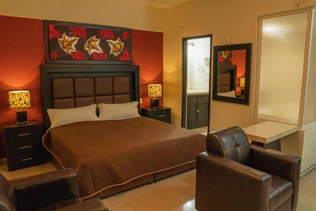 Postel nebo postele na pokoji v ubytování HOTEL ZAPOTLAN