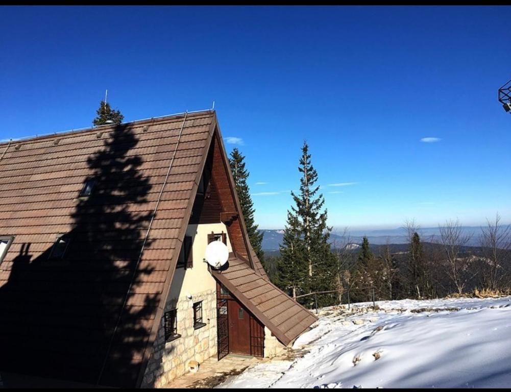 a roof of a house with a snow covered slope at Villa Aleksandra Jahorina in Jahorina