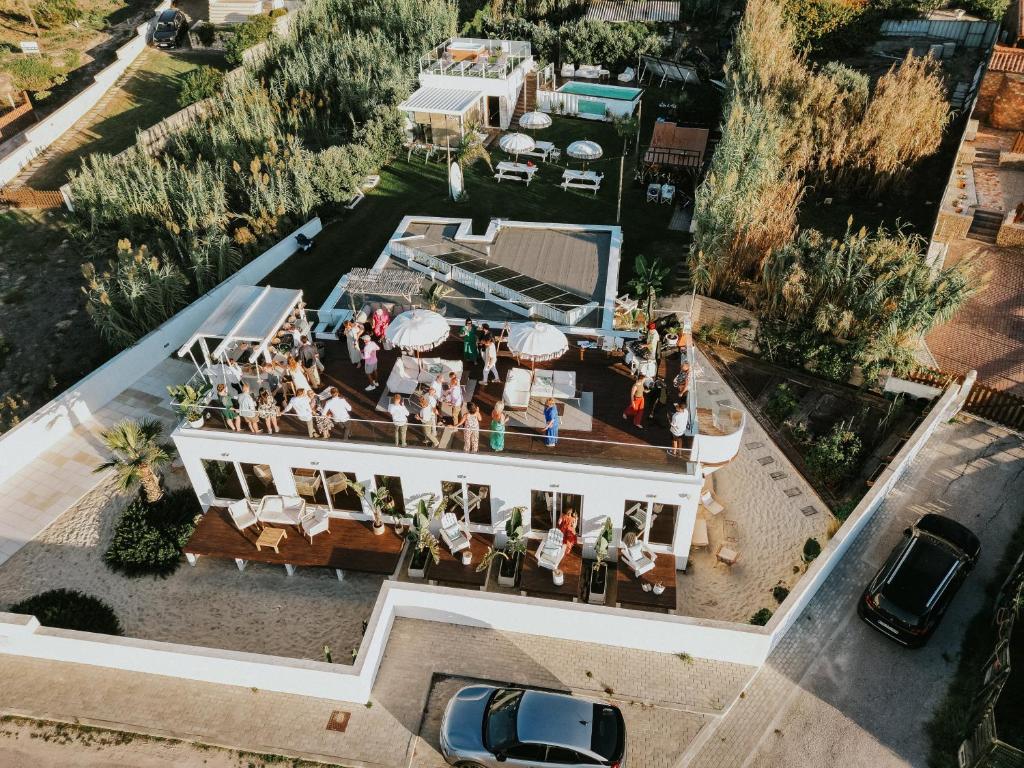 an overhead view of a building with people on it at We Surf House in Figueira da Foz