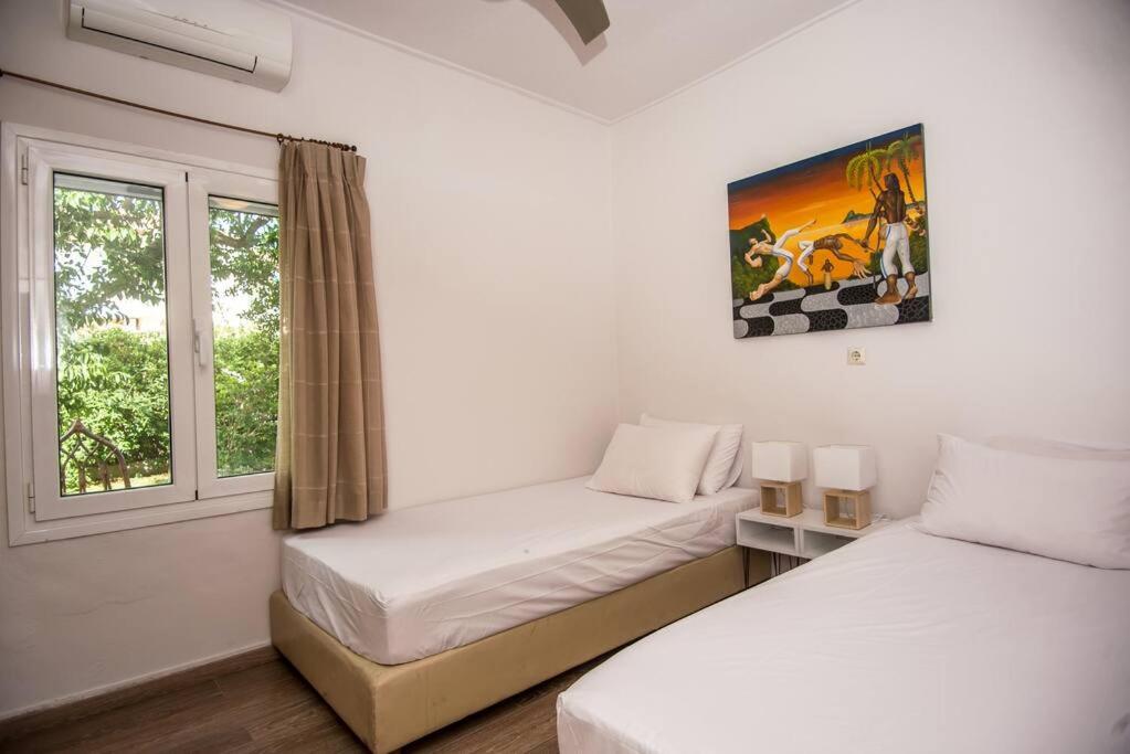 Postel nebo postele na pokoji v ubytování House in Lakithra