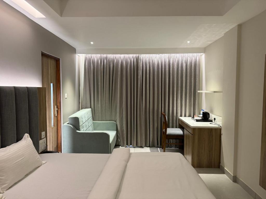 Postel nebo postele na pokoji v ubytování Hotel Devdeep Porvorim