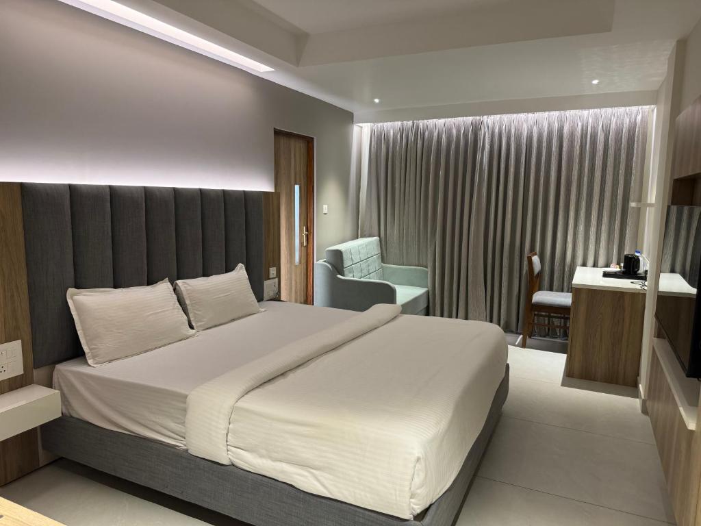 Postel nebo postele na pokoji v ubytování Hotel Devdeep Porvorim