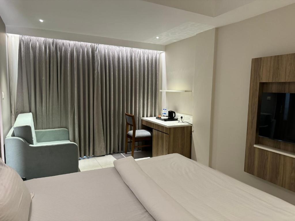 Postel nebo postele na pokoji v ubytování Hotel Devdeep Porvorim
