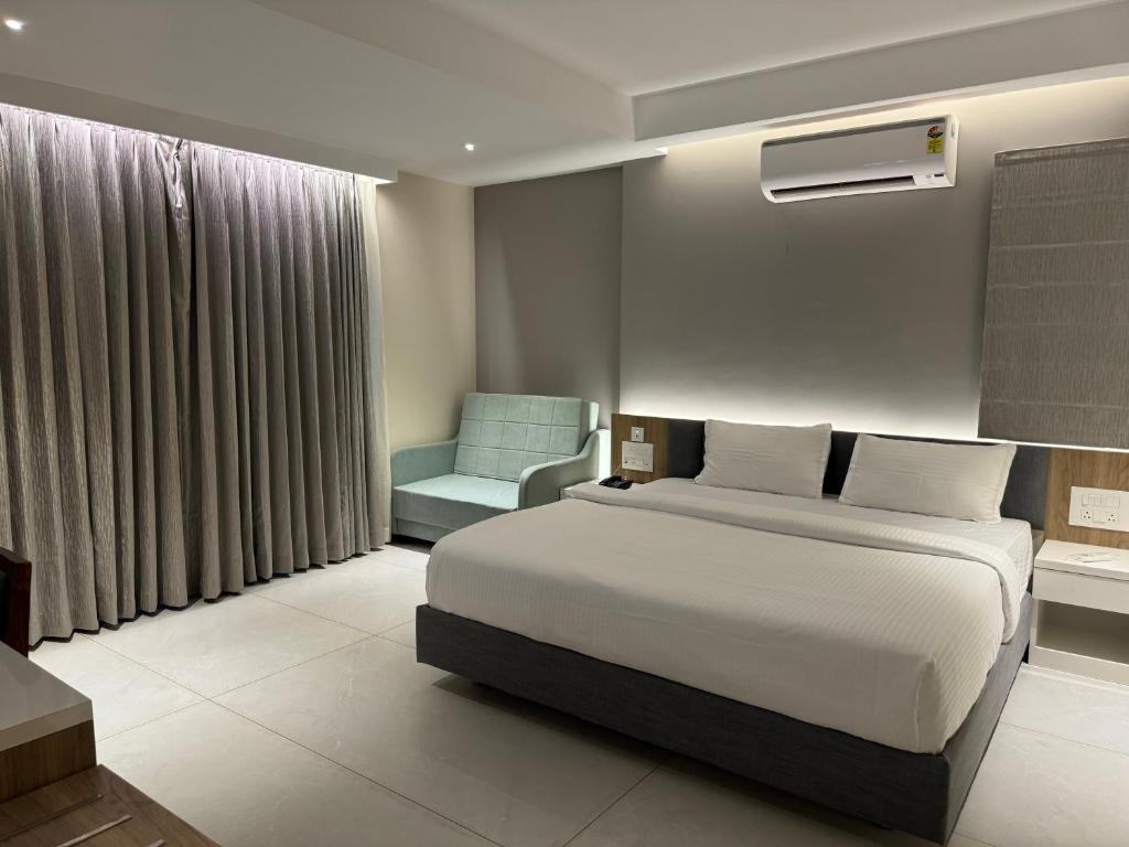 Postel nebo postele na pokoji v ubytování Hotel Devdeep Porvorim