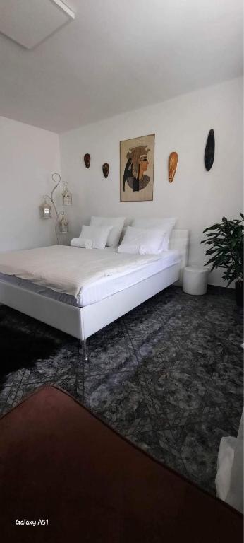 A bed or beds in a room at Penzion Ivka