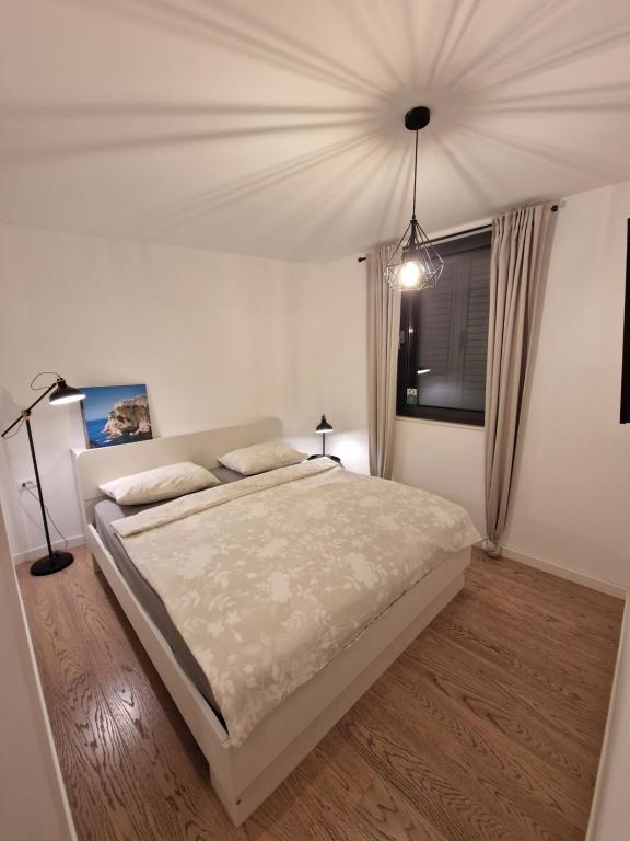 Posteľ alebo postele v izbe v ubytovaní Apartment LuNi