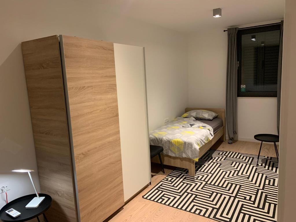 Posteľ alebo postele v izbe v ubytovaní Apartment LuNi