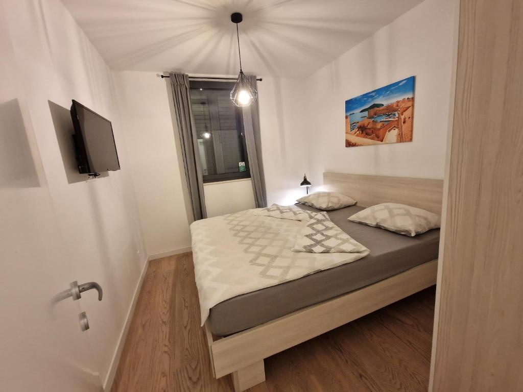 Posteľ alebo postele v izbe v ubytovaní Apartment LuNi