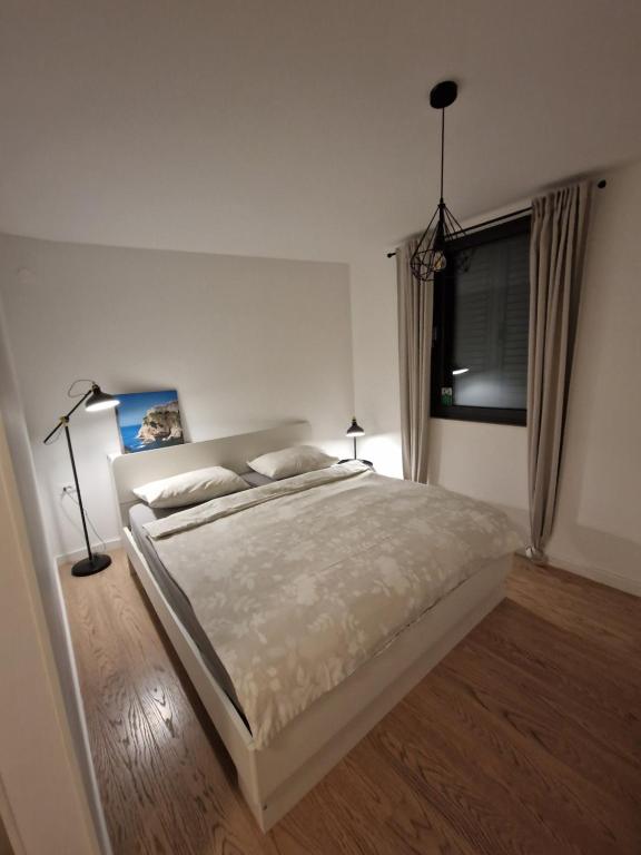Posteľ alebo postele v izbe v ubytovaní Apartment LuNi