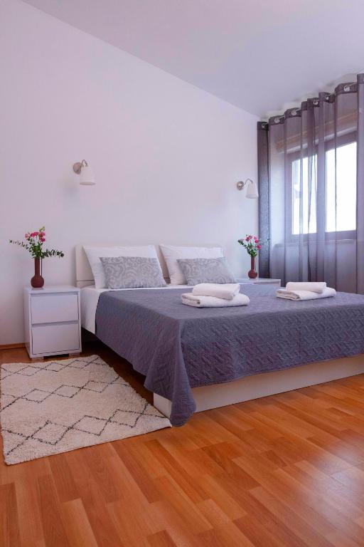 Posteľ alebo postele v izbe v ubytovaní Apartman Ivo