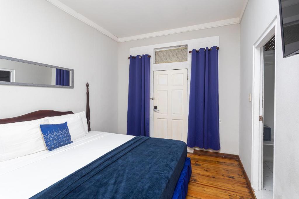 Postel nebo postele na pokoji v ubytování Caribic House