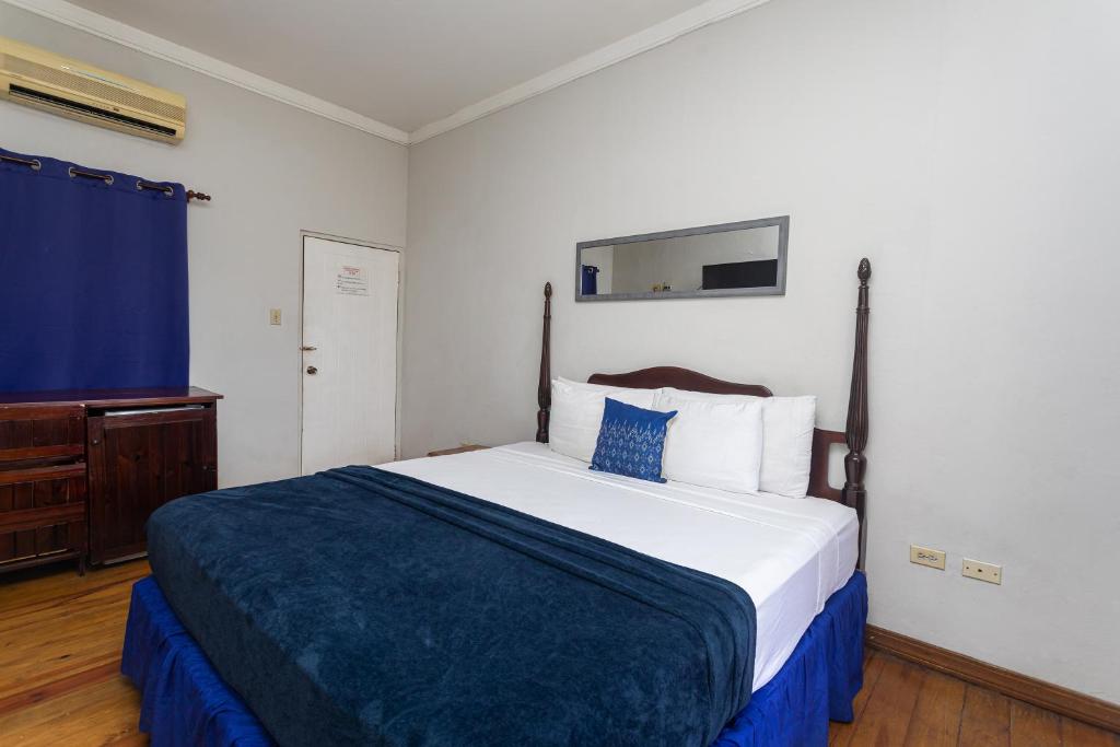 Postel nebo postele na pokoji v ubytování Caribic House
