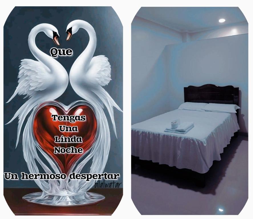 two white swans are standing next to a bed at Amazon deluxe in Jaén