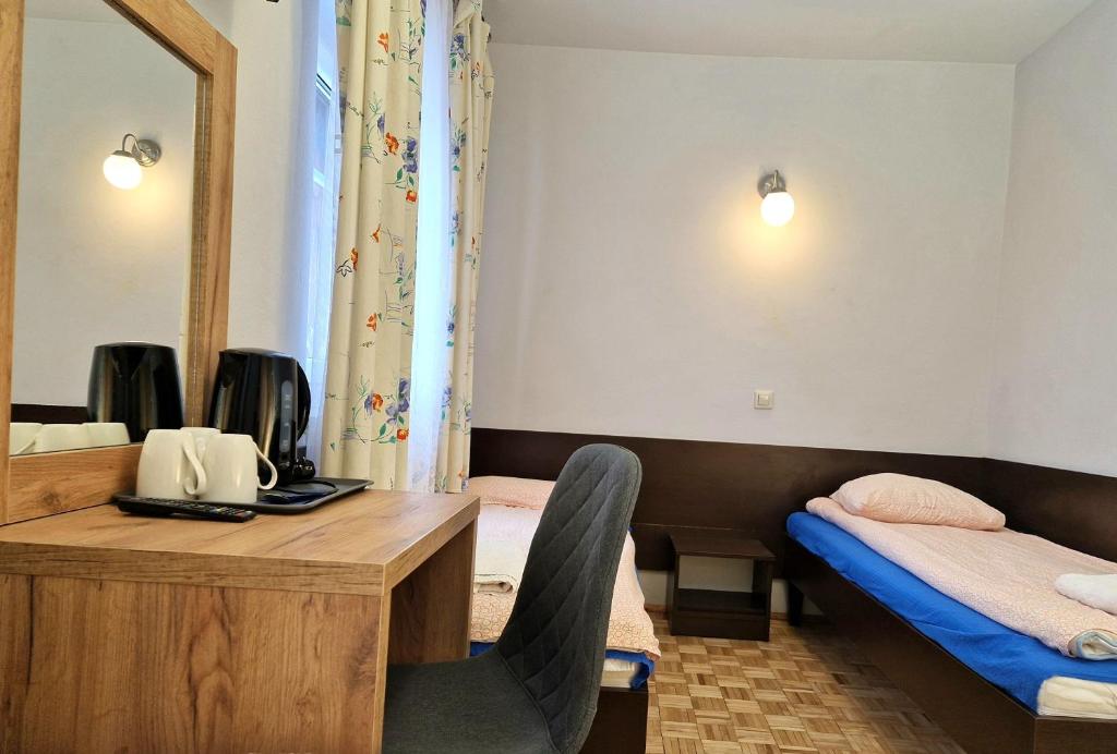Posteľ alebo postele v izbe v ubytovaní Bolko