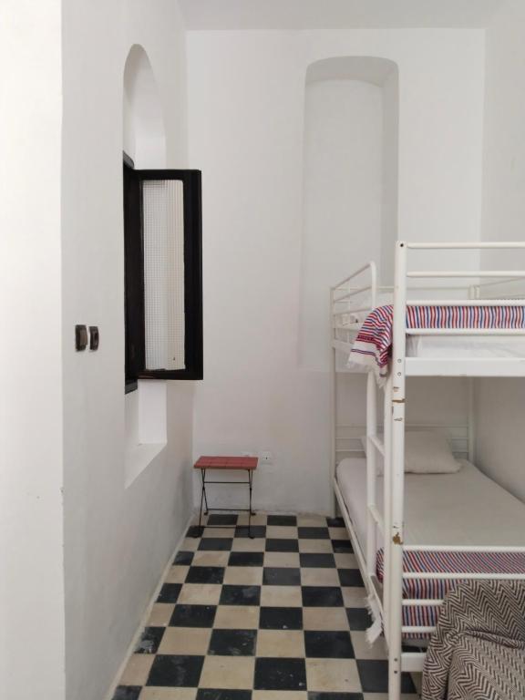 Postel nebo postele na pokoji v ubytování Dar Gara