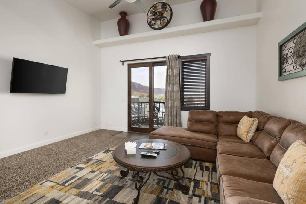 a living room with a couch and a table at Luxury Downtown Rental - La Dolce Vita Villa #3 in Moab