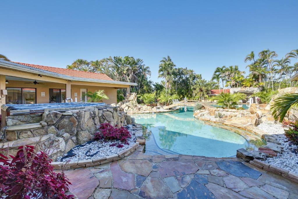 an image of a swimming pool in a resort at Spacious Villa in Coral Springs with Pool and Hot Tub! in Coral Springs