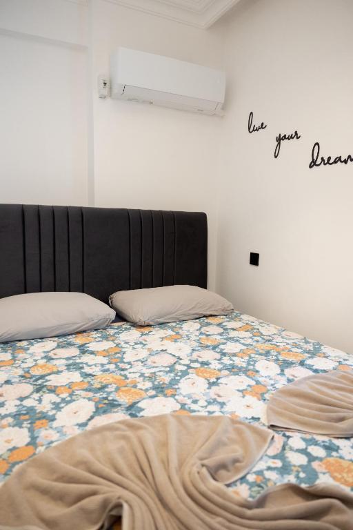 A bed or beds in a room at Melissas Suites Lara