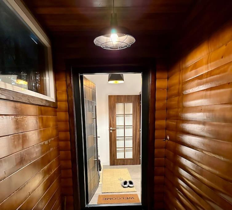 a hallway with a door leading to a room with a mirror at Villa Noari, Brezovice. in Brezovica