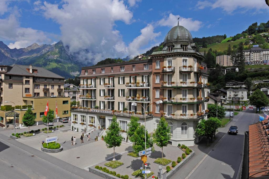 a building with a dome on top of a street at Hotel Schweizerhof in Engelberg