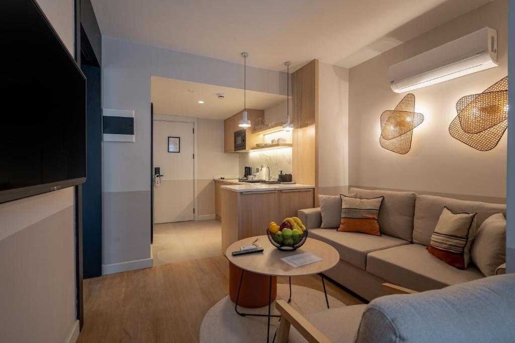 TV a/nebo společenská místnost v ubytování Oli Hotel and Suites