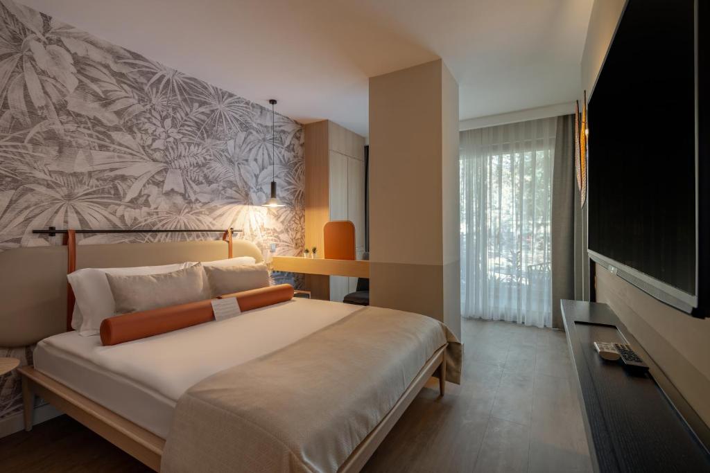 TV a/nebo společenská místnost v ubytování Oli Hotel and Suites