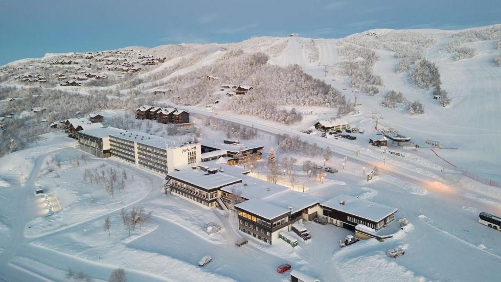 an aerial view of a resort in the snow at Radisson Blu Resort, Beitostølen in Beitostøl