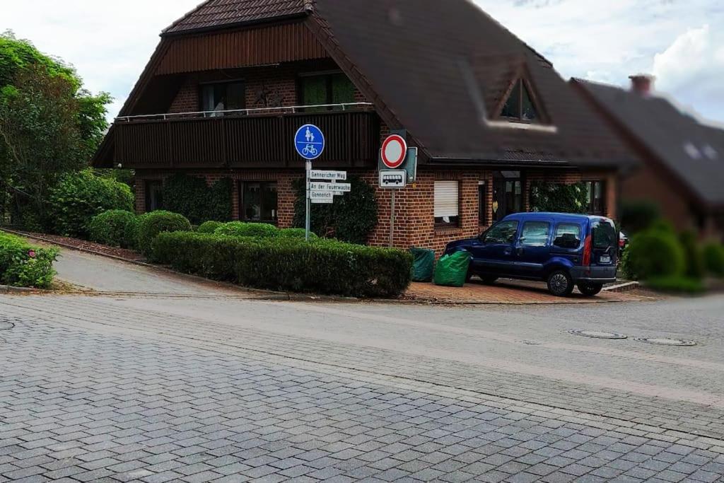 a blue van parked in front of a building at Schöne voll ausgestattete Ferienwohnung in Havixbeck