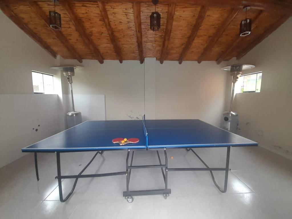 a blue ping pong table in a room at Veronica lookout Hotel in Urubamba